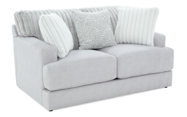 Contemporary Sofia Gray 70'' Loveseat in gray polyester fabric with channel tufted back cushions, plush accent pillows, and memory foam seating for luxury comfort.