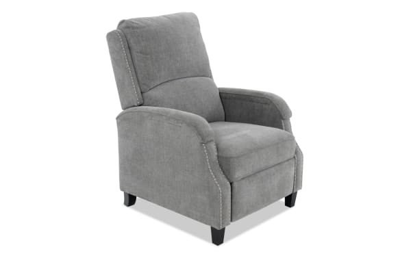 Gray fabric upholstered recliner chair with cushioned backrest and seat, nailhead trim accents, and black wooden legs, modern style.