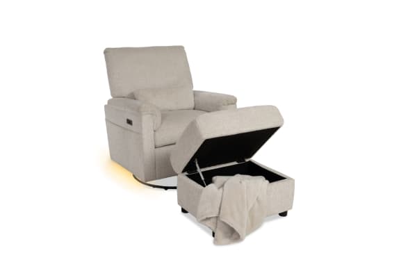 Beige fabric recliner chair with a matching storage ottoman featuring a soft throw blanket, designed for comfort and relaxation.