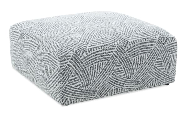 Transitional Sofia Black Cocktail Ottoman in polyester fabric with oversized square design and black-and-white woven pattern, from Sofia collection.