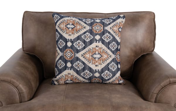 Raleigh Cognac Chair in brown faux leather with plush arms, traditional style, polyester fabric upholstery, and a patterned accent pillow for cozy relaxation.