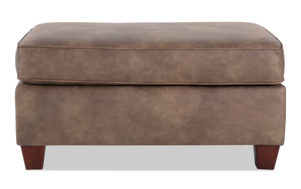 Raleigh Cognac Ottoman in traditional style with brown faux leather polyester upholstery, memory foam cushion, and wooden legs for comfortable seating.