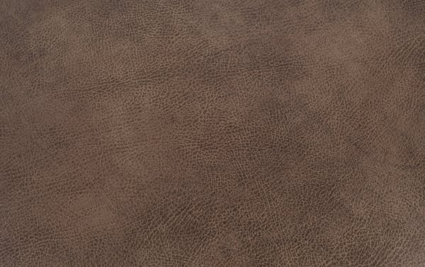 Traditional Raleigh Cognac Ottoman upholstered in brown polyester fabric with textured faux leather look, part of Raleigh collection for stylish living rooms.