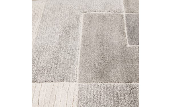 Gray geometric transitional rug with plush thick pile, made of durable polypropylene, measuring 5' x 7', ideal for modern home decor.