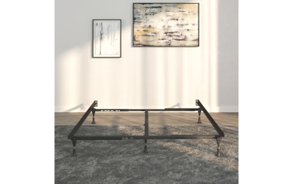 Twin/Full/Queen bed frame made of black steel with adjustable legs and center support, designed for durable, stable mattress support on carpeted floors.