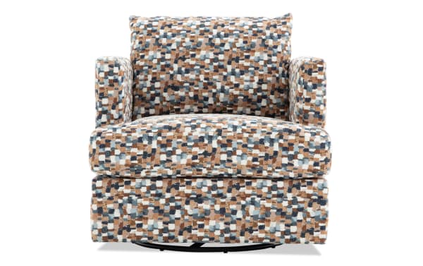 Multicolored patterned fabric swivel armchair with cushioned seat and backrest, featuring a mix of blue, brown, and beige tones in a pixelated design.