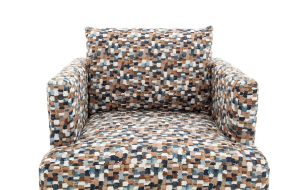 Upholstered armchair with a multicolored pixelated pattern in shades of brown, blue, white, and black, featuring a cushioned backrest and armrests.