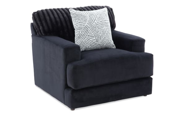 Contemporary Sofia Black Chair upholstered in black polyester fabric with channel tufted back cushions and plush accent pillow, featuring Bob-O-Pedic Memory Foam for added comfort.