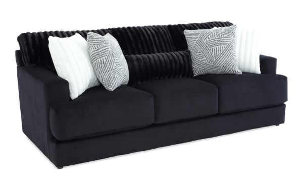 Sofia Black 93'' Sofa in black polyester fabric with contemporary style, channel tufted seat back cushions, and multiple accent pillows for added comfort.