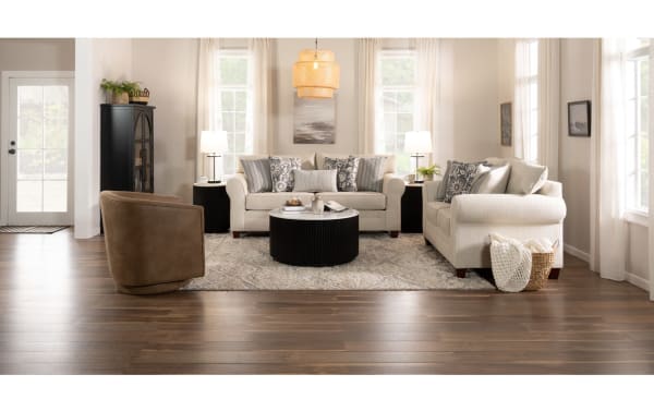 Transitional Portland Beige 65" loveseat in soft polyester fabric with rolled arms, plush cushions, and decorative accent pillows, part of the Portland collection.
