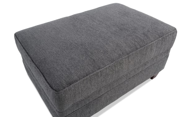 Portland Gray Storage Ottoman in transitional style, upholstered in soft gray polyester fabric with cushioned top and hidden storage.