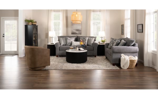 Transitional Portland Gray 85'' Sofa in soft gray polyester fabric with patterned and striped accent pillows, part of the Portland collection.