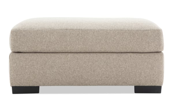 Camden Gray Ottoman in gray polyester fabric with plush memory foam cushion, transitional style, low-profile rectangular design, and black block feet.