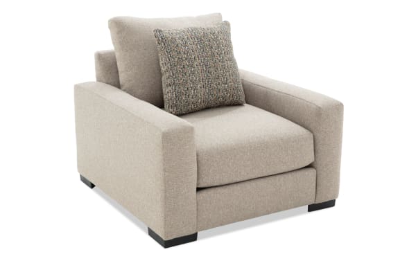 Transitional Camden Gray Chair upholstered in soft gray polyester fabric with plush memory foam cushion and textured accent pillow.