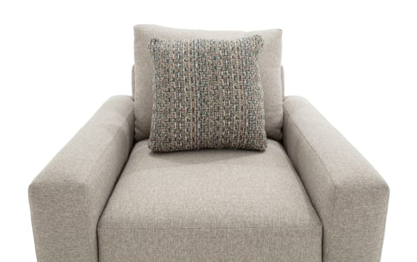 Transitional Camden Gray Chair upholstered in soft gray polyester fabric, featuring wide armrests and a textured accent pillow for added comfort.