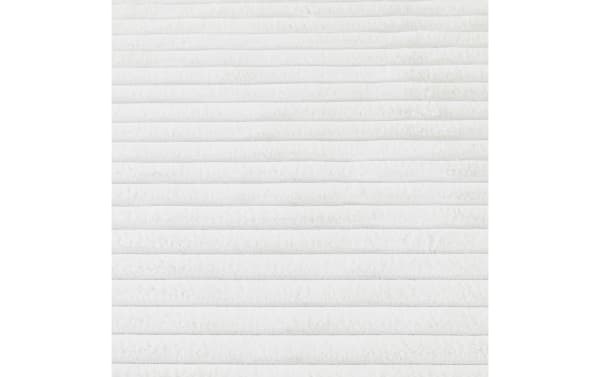 Sofia 2' x 4' white solid washable rug with ultra-plush medium pile, soft polyester fabric, and transitional style for cozy flooring comfort.