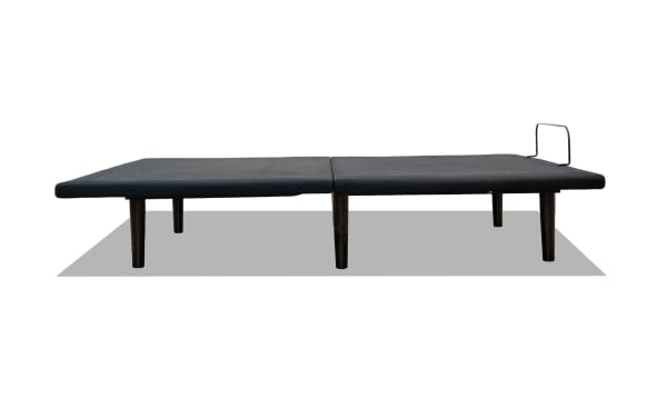 Power Bob Elite Full Adjustable Base in black fabric with sturdy black legs, featuring wireless remote control, LED underbed lighting, and multiple USB ports for charging.