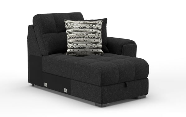 Modern black fabric chaise lounge with tufted seat and backrest, featuring two decorative pillows, designed for living room comfort and style.