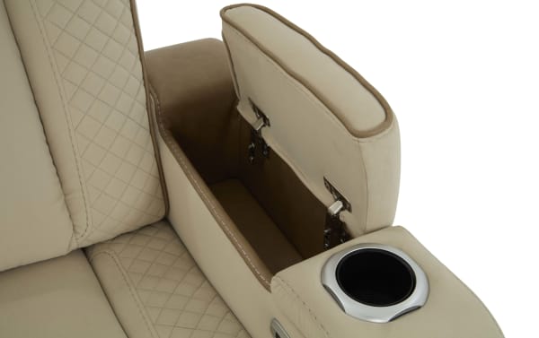 Beige fabric sofa armrest with built-in storage compartment and cup holder, featuring quilted stitching and metal hinges for easy access.