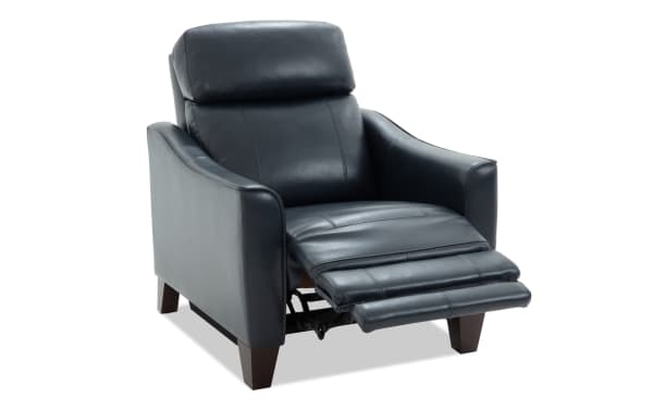 Black leather recliner chair with padded armrests, cushioned backrest, and extended footrest, featuring wooden legs and modern design.
