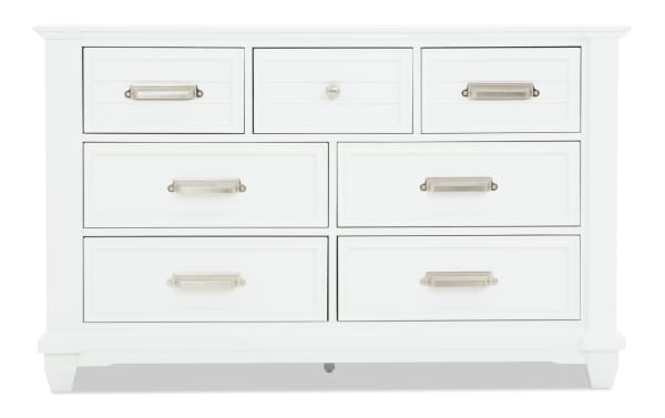 Sunset Cove Youth White 7 Drawer Dresser in coastal style, made of white MDF with seven smooth-gliding drawers, including a felt-lined top drawer.