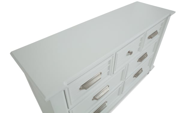 Sunset Cove Youth White 7 Drawer Dresser in coastal style, MDF construction, smooth-gliding drawers, felt-lined top drawer for kids’ rooms.