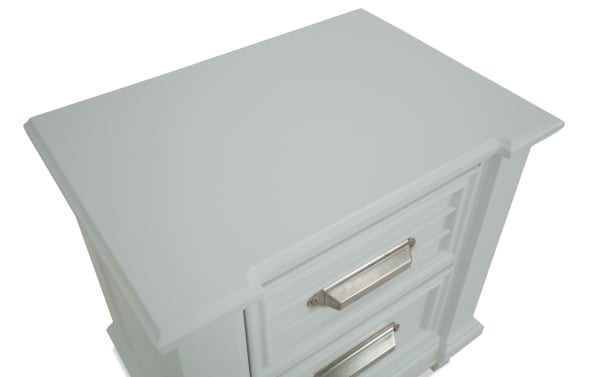 Sunset Cove Youth White 2 Drawer Nightstand in coastal style, made of white MDF with smooth metal handles and felt-lined top drawer.
