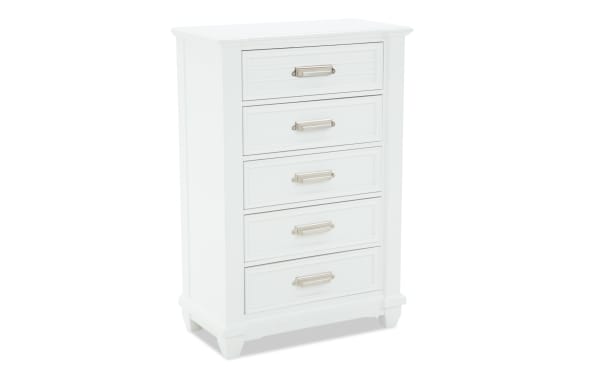 Sunset Cove Youth White 5 Drawer Chest in coastal style, made of white MDF with smooth glides, felt-lined top drawer, and five spacious storage drawers.