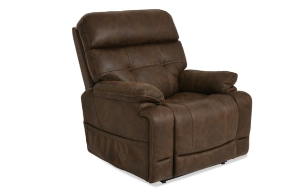 Brown leather recliner chair with padded armrests and cushioned backrest, designed for comfort and relaxation in living rooms.