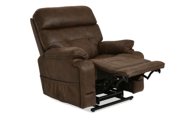 Brown leather recliner chair with padded armrests and cushioned backrest, featuring an extended footrest and visible metal reclining mechanism.