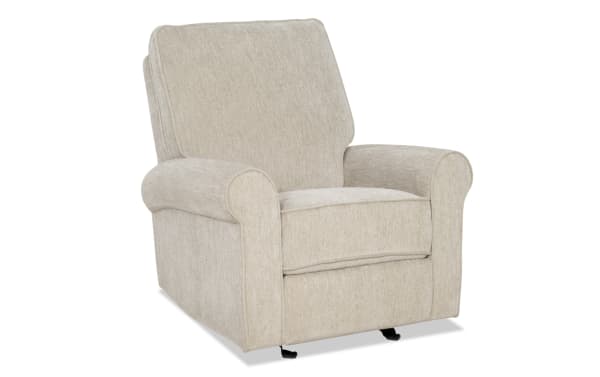 Beige fabric recliner chair with cushioned backrest, padded armrests, and a soft textured upholstery, designed for living room comfort.