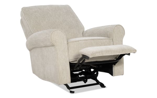 Beige fabric upholstered recliner chair with cushioned armrests and backrest, featuring a metal reclining mechanism and extended footrest.