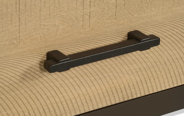 Matte black metal drawer handle with a modern rectangular design mounted on light natural wood grain surface, suitable for furniture hardware.