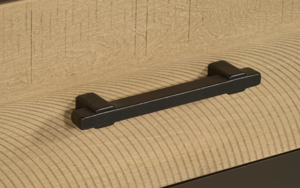 Black metal drawer handle with a simple rectangular design mounted on light natural wood grain surface, suitable for modern furniture hardware.