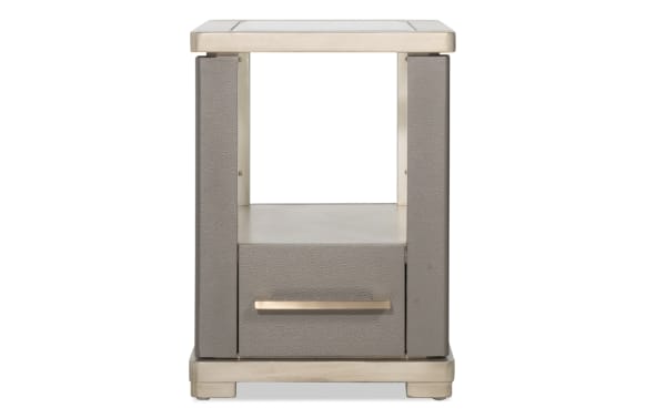 Contemporary gray faux leather nightstand with silver metal trim, one drawer with a horizontal silver handle, and an open shelf.
