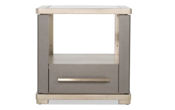 Modern gray nightstand with textured finish, single drawer with brushed metal handle, open shelf, and metallic frame base.