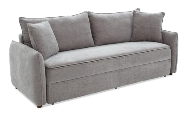 Modern gray fabric sofa with three back cushions and two matching side pillows, featuring soft upholstery and rounded armrests for living room seating.