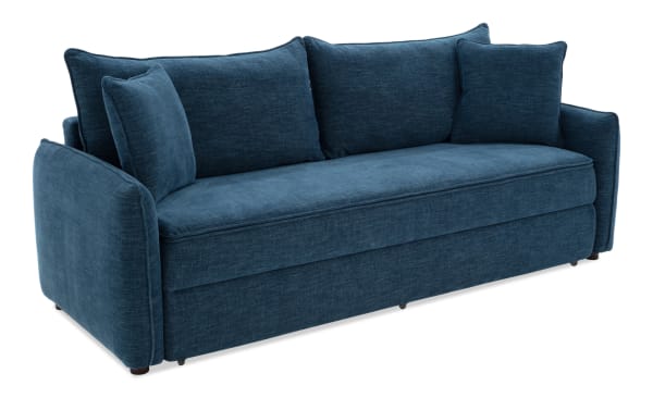 Modern blue fabric sofa with plush cushions, curved armrests, and a deep seating area, ideal for living room comfort and style.