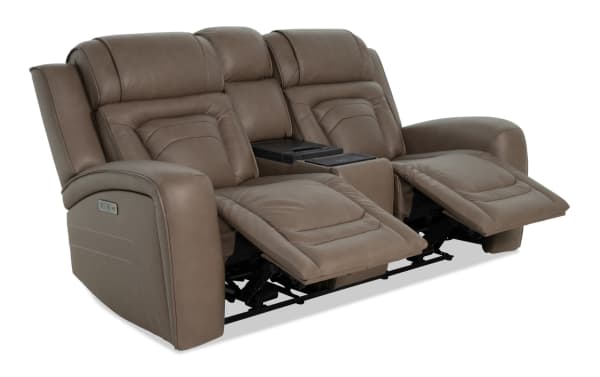 Brown leather reclining loveseat with padded armrests, adjustable footrests, and a center console with cup holders, designed for comfort and relaxation.