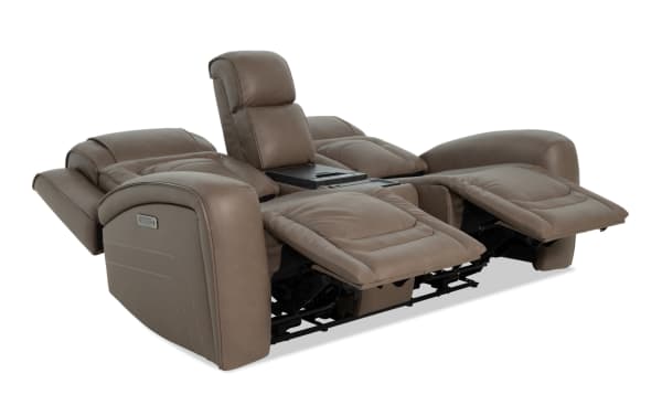 Modern brown leather dual recliner sofa with padded armrests, adjustable headrests, and center console with cup holders, designed for living room comfort.