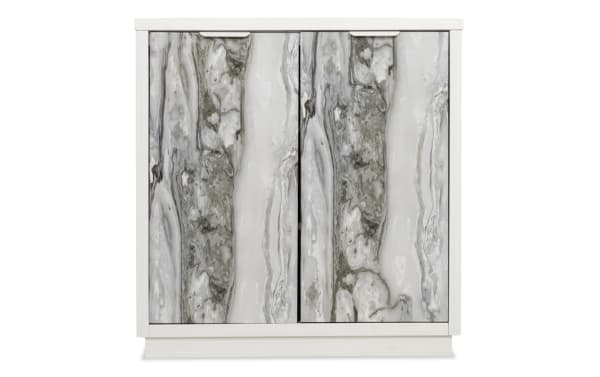 White wooden cabinet with two doors featuring a gray and white marble pattern, suitable for modern home storage.