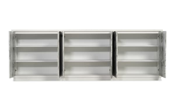 White modern storage cabinet with three compartments, each featuring double doors and two interior shelves, designed for organized storage.