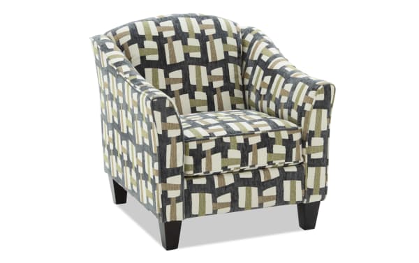 Upholstered armchair with a modern geometric pattern in beige, black, and brown tones, featuring a cushioned seat and tapered wooden legs.