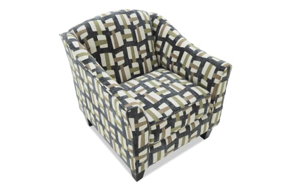 Armchair with a geometric patterned fabric upholstery in shades of beige, brown, black, and white, featuring a cushioned seat and curved armrests.