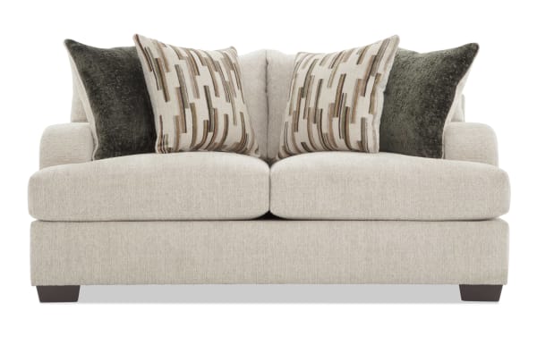 Beige Cypress 70'' loveseat with transitional design, plush Bob-O-Pedic® memory foam cushions, polyester fabric upholstery, and patterned accent pillows for comfort and style.