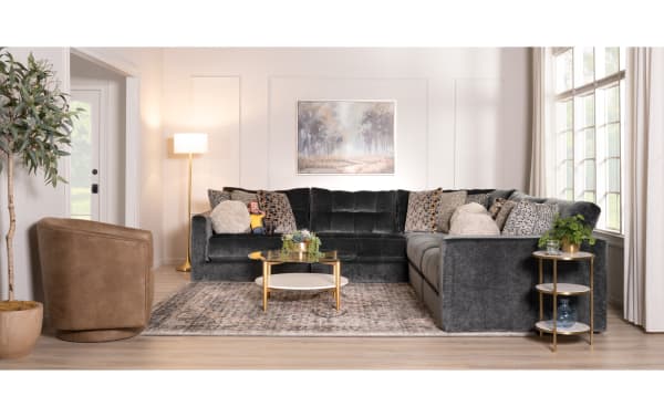 Emerald green Jewels sectional sofa with plush polyester fabric, Bob-O-Pedic Gel Memory Foam cushions, glam style, and decorative accent pillows in a bright living room.