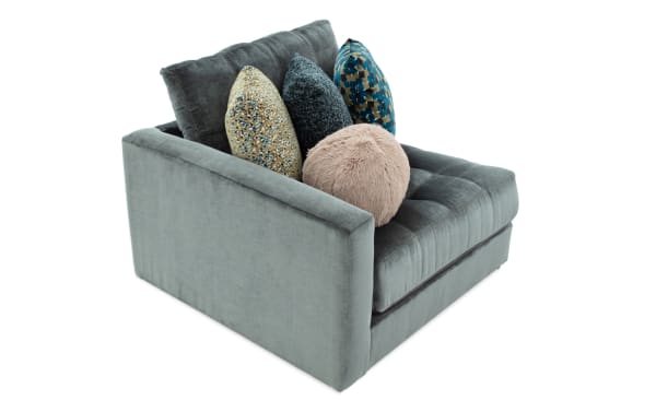 Emerald green Jewels Emerald Left Arm Facing Chair with plush polyester fabric, tufted seat, and assorted accent pillows from the glam Jewels collection.