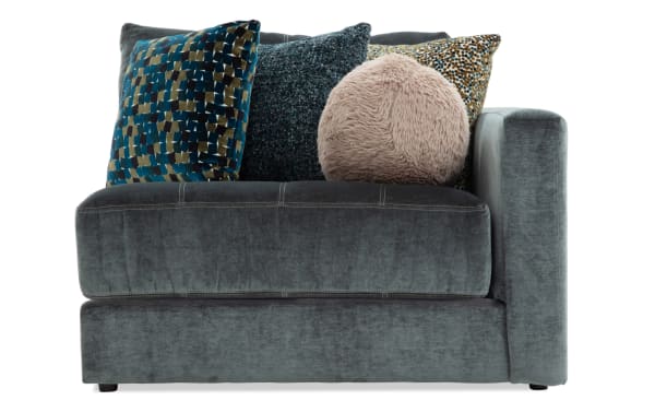 Emerald green Jewels sectional right arm facing chair with plush polyester fabric, glam style, and decorative accent pillows for luxury comfort.