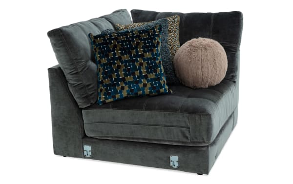 Emerald green Jewels Emerald Corner sectional in glam style, upholstered in soft polyester fabric with plush cushions and decorative accent pillows.