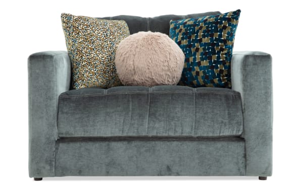 Emerald green Jewels Emerald Side Chair with plush polyester fabric, glam style, and three decorative accent pillows for added comfort.